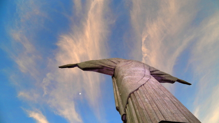 The Back of the statue of Christ the Redeemer, one of the seven wonders of the world of Open Arms on Guanabara Bay in Rio de Janeiro, Brazil on a sunny winter dayのeditorial素材
