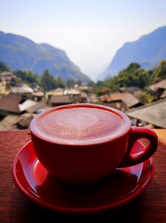 Cappuccino coffee in a beautiful mountain viewの写真素材