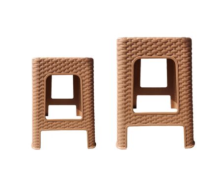 Brown woven chairs on white backdropの写真素材