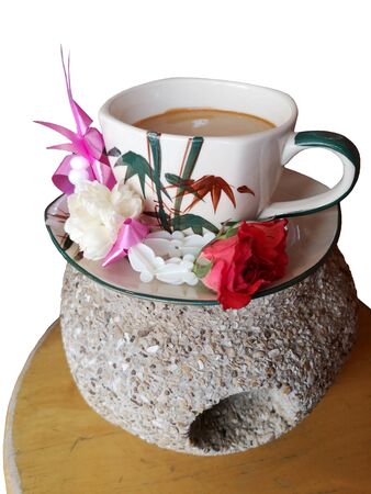 Hot coffee on the rock to worship According to religious beliefs on white backgroundの写真素材