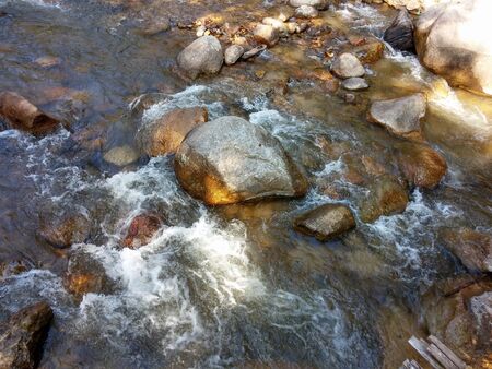 The rocks in the mineral water flow naturally through the Chae Son National Park, Lampang, Thailand.の写真素材