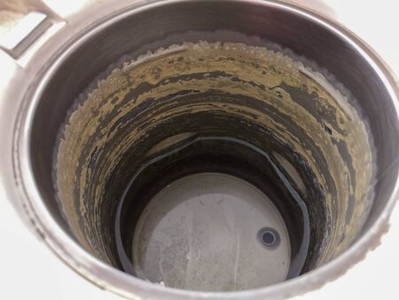 Scale in electric kettle There is a little water in the kettle.の写真素材