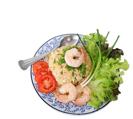 Big Shrimp Fried Rice With fresh vegetable side dishes in a white background, isolated and clipping pathの写真素材