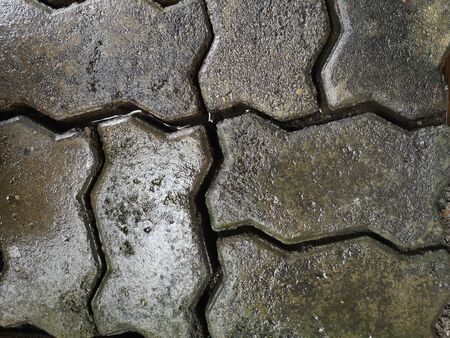 the block of wet foot path  abstract background textureの写真素材