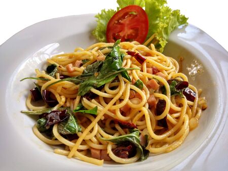Spaghetti Stir Fried with Dried Chilies on white backgroundの写真素材