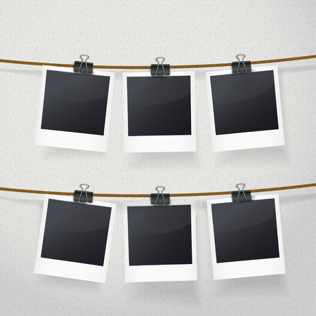 blank photo frames on rope over white backgroundのイラスト素材