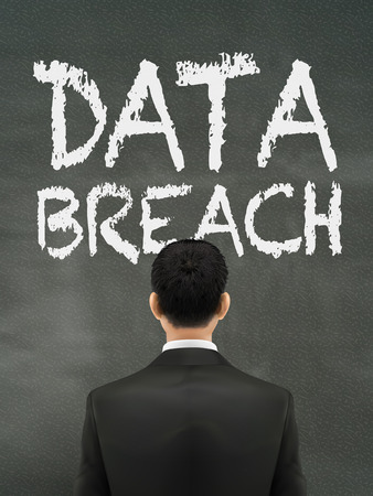 businessman looking at data breach words on wallのイラスト素材