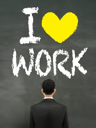 businessman looking at I love work words on wallのイラスト素材