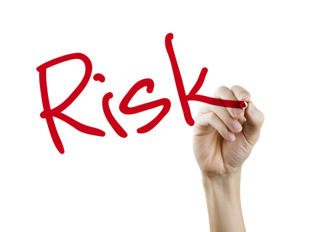 risk word written by hand over white backgroundの写真素材