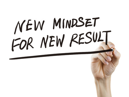 new mindset for new results words written by hand on a transparent boardの写真素材