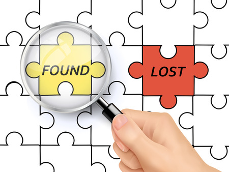 found word on jigsaw showing through magnifying glass held by handのイラスト素材
