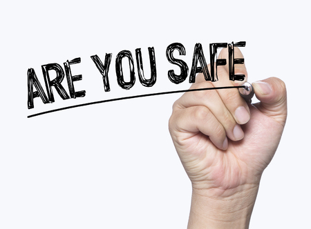 are you safe written by hand, hand writing on transparent board, photoの写真素材