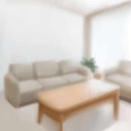 Blurred interior of living room with sofa set and wooden center table in 3D illustrationのイラスト素材