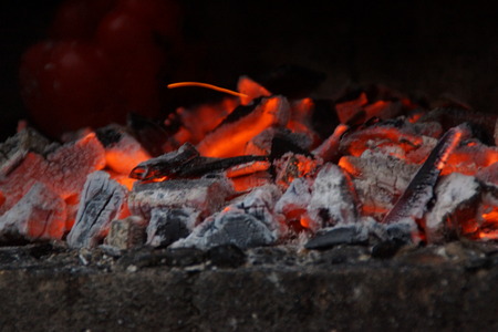 Embers in the barbecue, with an orange bright color. Front view, in outside and without character.の写真素材
