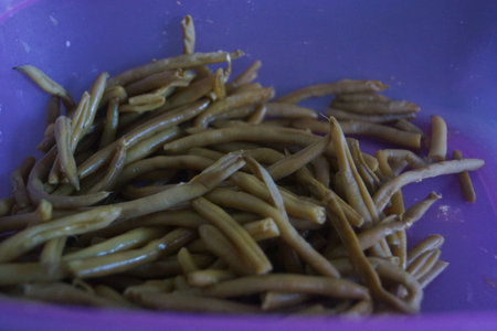A handful of fresh green beans, crisp and vibrant, captured in natural light. France.の写真素材