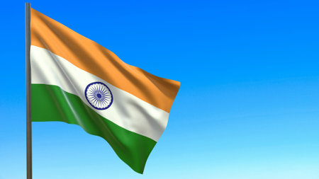 flag of india fluttering in the wind against a blue sky background 3d rendering.の写真素材