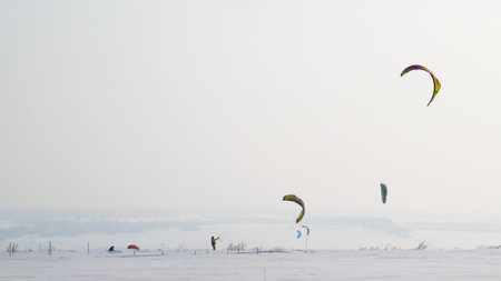 the man is snowkiting in the fieldの写真素材