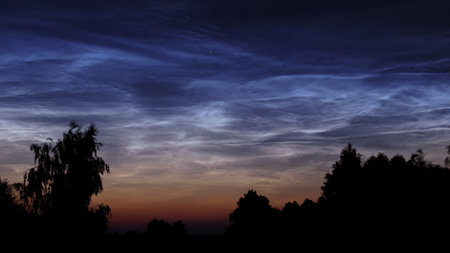 silvery clouds in the early summer morningの写真素材