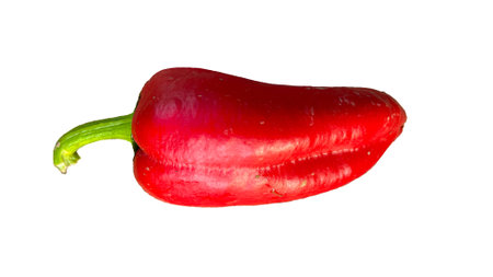 unwashed red peppers on a white backgroundの写真素材