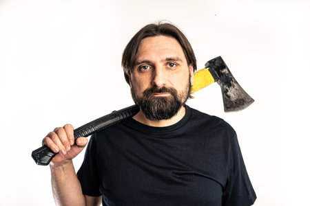 The man dressed in a black shirt poses in a photo studio.の写真素材