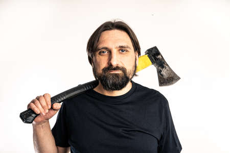 The man dressed in a black shirt poses in a photo studio.の写真素材