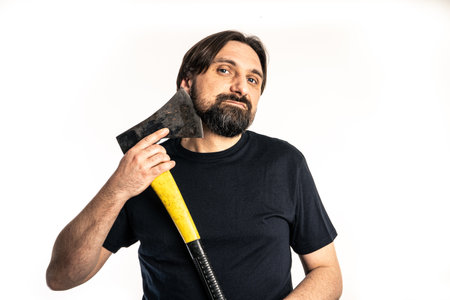 The man dressed in a black shirt poses in a photo studio.の写真素材