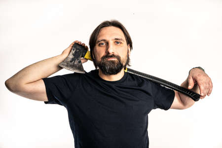 The man dressed in a black shirt poses in a photo studio.の写真素材