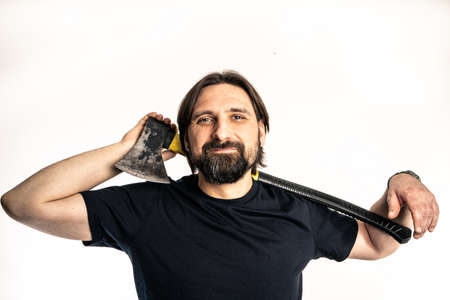 The man dressed in a black shirt poses in a photo studio.の写真素材