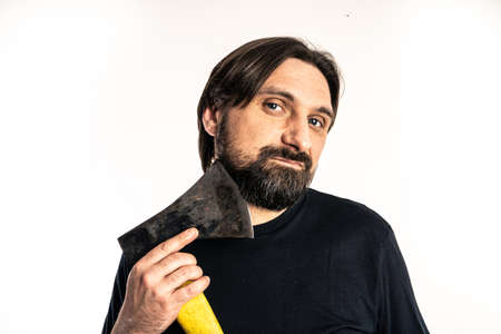 The man dressed in a black shirt poses in a photo studio.の写真素材