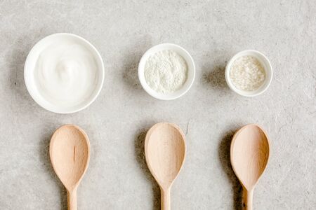 Female skin and body care cosmetic products set: facial cream, cosmetic clay, sea salt on gray marble background. Beauty blogger, salon treatmentsの写真素材