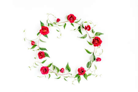 Wreath frame made of green branches, leaves and roses isolated on white background. lay flat, top viewの写真素材