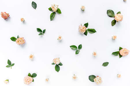 Texture made of roses and carnations, branches, floral pattern on a white background. The apartment lay, top view. Background For Valentine Day.の写真素材
