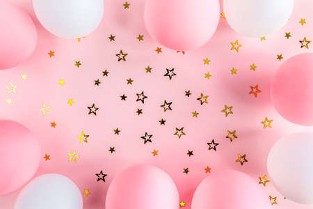 Frame from Balloons and confetti on pink background. Valentines day, Birthday, holiday concept. Flat lay, top viewの写真素材