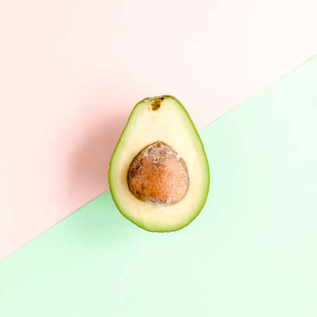 Board frame and summer tropical fruits: orange, lemon, lime, mango on pink background. Food concept....