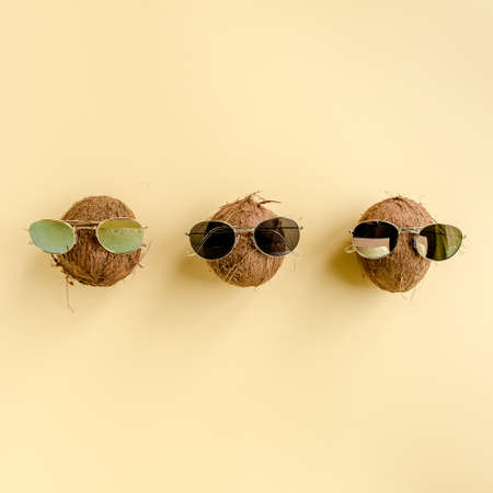 Coconuts on yellow background. The apartment lay, top viewの写真素材