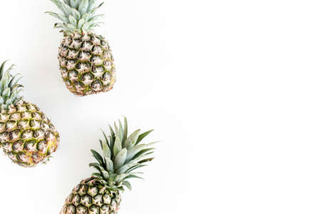 Pineapples isolated on white background. Food concept. Flat lay, top view