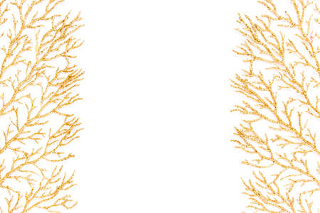 Christmas or new year frame composition. Pattern made of golden leaves on white background. Flat...