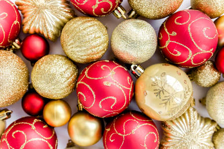 Christmas texture: red and gold glass Christmas balls on a white background. the apartment lay, top viewの写真素材