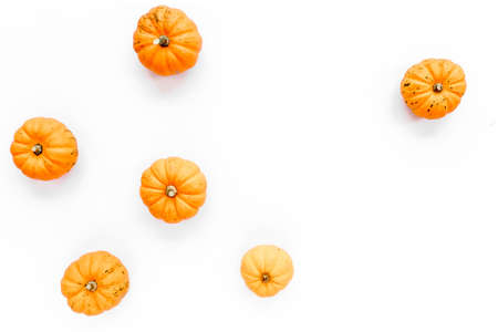 Orange pumpkins Halloween isolated on white background. Flat lay, top view. Autumn minimal concept.の写真素材