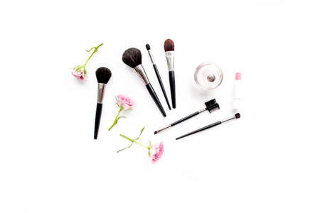 Makeup tools. Home office workspace. Female fashion, makeup brushes, cup of coffee on white...