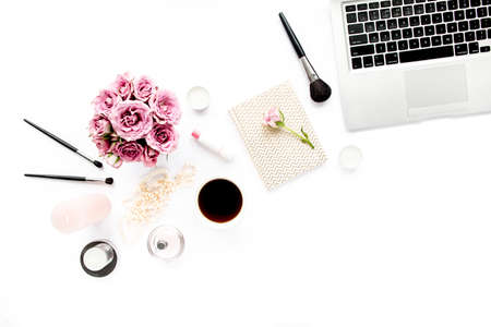 Makeup tools. Home office workspace. Female fashion, makeup brushes, cup of coffee on white background. Flat composition. Top view. Flat lay.の写真素材