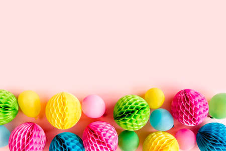 Balloons and confetti on pink background. Birthday, holiday concept. Flat lay, top view. Birthday party backgroundの写真素材