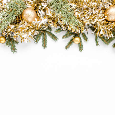 Christmas composition with fir branches, christmas balls and tinsel. Flat lay, top viewの写真素材