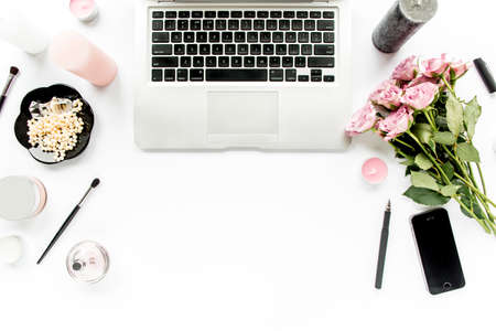 Makeup tools. Home office workspace. Female fashion, makeup brushes, cup of coffee on white background. Flat composition. Top view. Flat lay.の写真素材