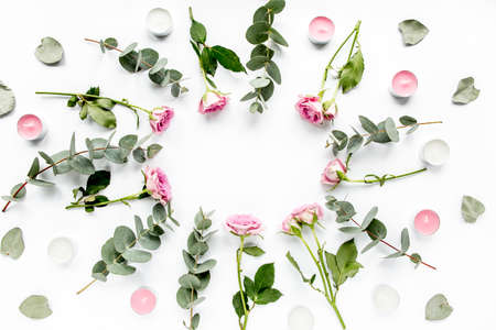 wreath frame with roses, eucalyptus branches, leaves isolated on white background. flat lay, overhead viewの写真素材