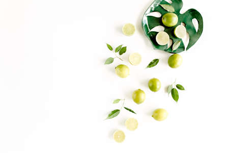 Pattern made of lime and leaves ficus. Food concept. flat lay, top view