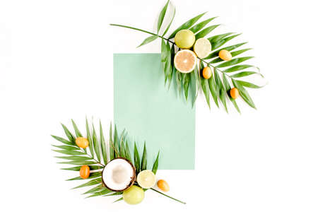 Creative layout made of paper and summer tropical fruits on white background. Food concept. flat lay, top viewの写真素材