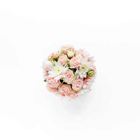 bouquet roses, in girls hands on white background. flat lay, top view conceptの写真素材