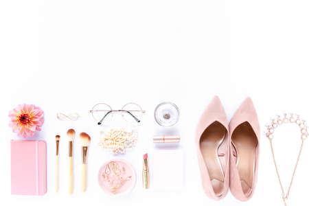 Pale pink female shoes on white background. Flat lay, top view trendy fashion feminine background. Beauty blog concept.の写真素材