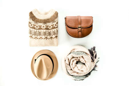 Woman clothes and accessories set on white background top view. modern and casual outfit. fashion, shopping and makeup concept. Flat lay, top view.の写真素材